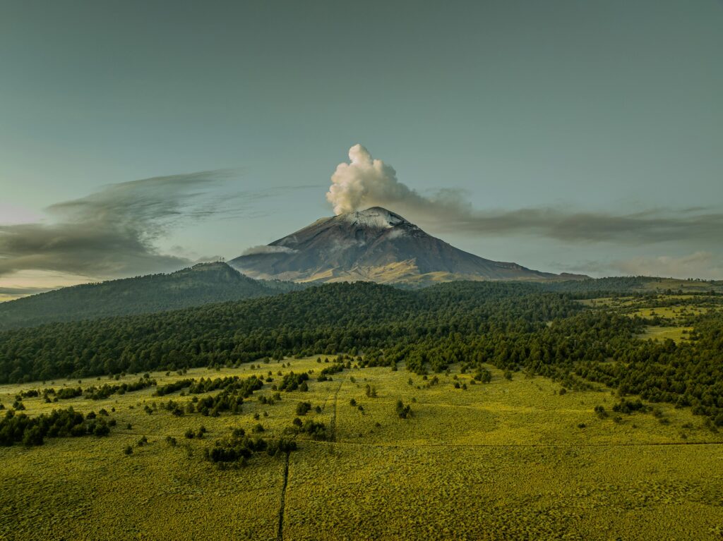 Mysterious glowing UFO caught on camera hovering over Mexico’s Popocatepetl volcano before zipping away. Experts say it could be linked to magnetic field phenomena.