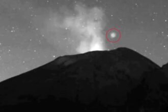 Mysterious glowing UFO caught on camera hovering over Mexico’s Popocatepetl volcano before zipping away. Experts say it could be linked to magnetic field phenomena.