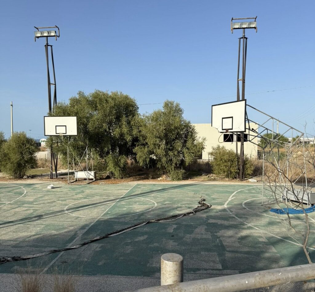 An urban explorer uncovered an abandoned Sicilian hotel with furnished rooms and a decaying swimming pool frozen in time offering a haunting glimpse into its forgotten past.