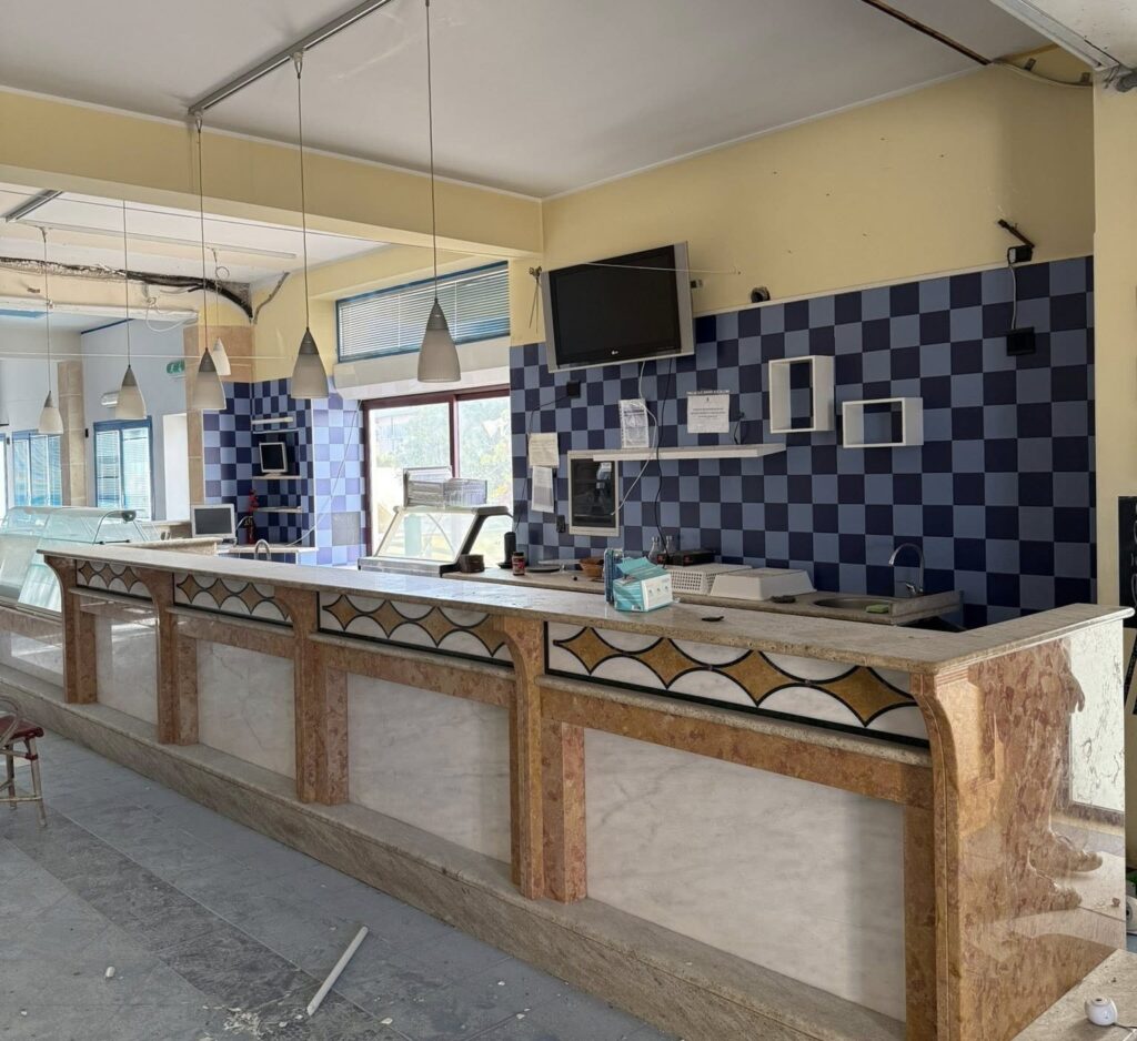 An urban explorer uncovered an abandoned Sicilian hotel with furnished rooms and a decaying swimming pool frozen in time offering a haunting glimpse into its forgotten past.