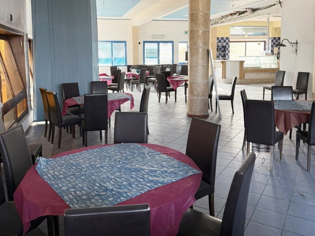 An urban explorer uncovered an abandoned Sicilian hotel with furnished rooms and a decaying swimming pool frozen in time offering a haunting glimpse into its forgotten past.