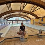 An urban explorer uncovered an abandoned Sicilian hotel with furnished rooms and a decaying swimming pool frozen in time offering a haunting glimpse into its forgotten past.