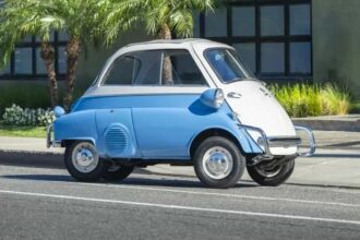 A charming 1957 BMW Isetta 300 microcar expected at 22000 pounds offers restored blue and white style 53mph top speed and classic appeal ahead of its RM Sotheby’s auction today.