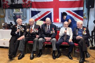 Five World War II veterans with a combined age of 505 formed the world’s oldest boy band after singing Vera Lynn’s We’ll Meet Again at a Remembrance lunch in Essex.