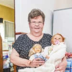 South African woman Marie Odendaal lives with 100 dolls and makes 400 outfits a week treating them as her babies as she talks to them proudly and supports her daughter through her doll clothing business.