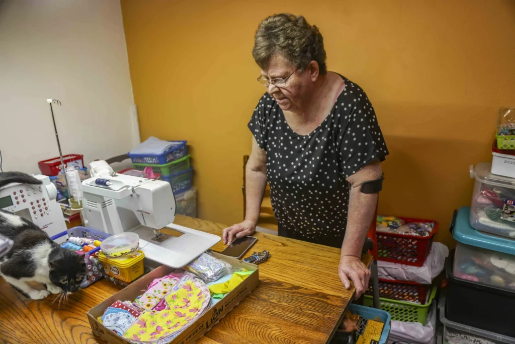 South African woman Marie Odendaal lives with 100 dolls and makes 400 outfits a week treating them as her babies as she talks to them proudly and supports her daughter through her doll clothing business.