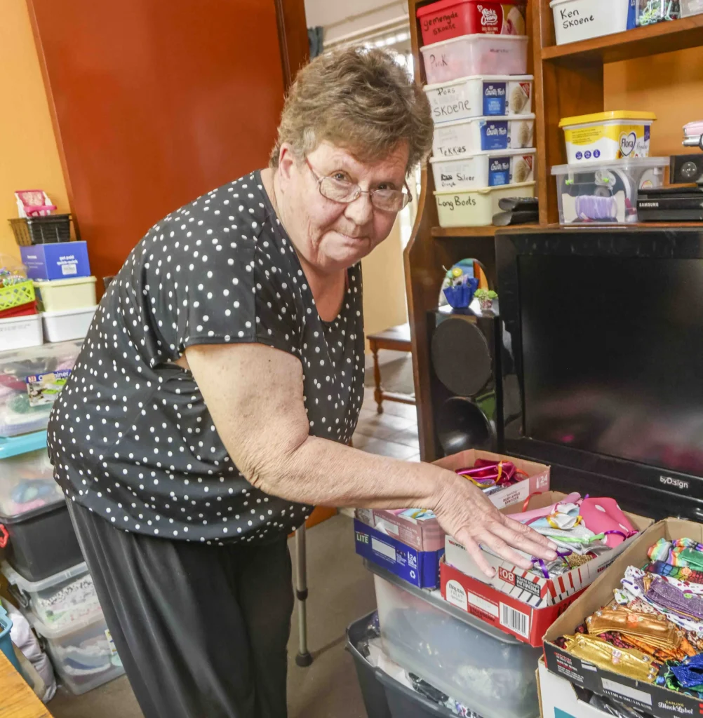 South African woman Marie Odendaal lives with 100 dolls and makes 400 outfits a week treating them as her babies as she talks to them proudly and supports her daughter through her doll clothing business.
