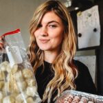 Mum Hannah Lumber cooks her entire Christmas dinner in November freezes it then reheats on the day saying it saves hours of stress tastes banging and lets her enjoy family time fully.