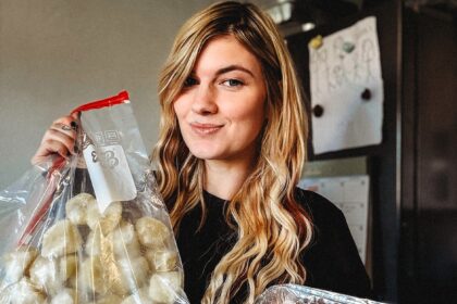 Mum Hannah Lumber cooks her entire Christmas dinner in November freezes it then reheats on the day saying it saves hours of stress tastes banging and lets her enjoy family time fully.