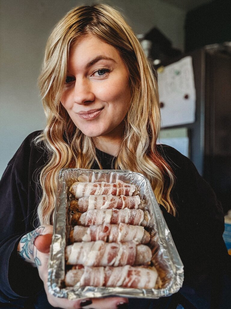 Mum Hannah Lumber cooks her entire Christmas dinner in November freezes it then reheats on the day saying it saves hours of stress tastes banging and lets her enjoy family time fully.