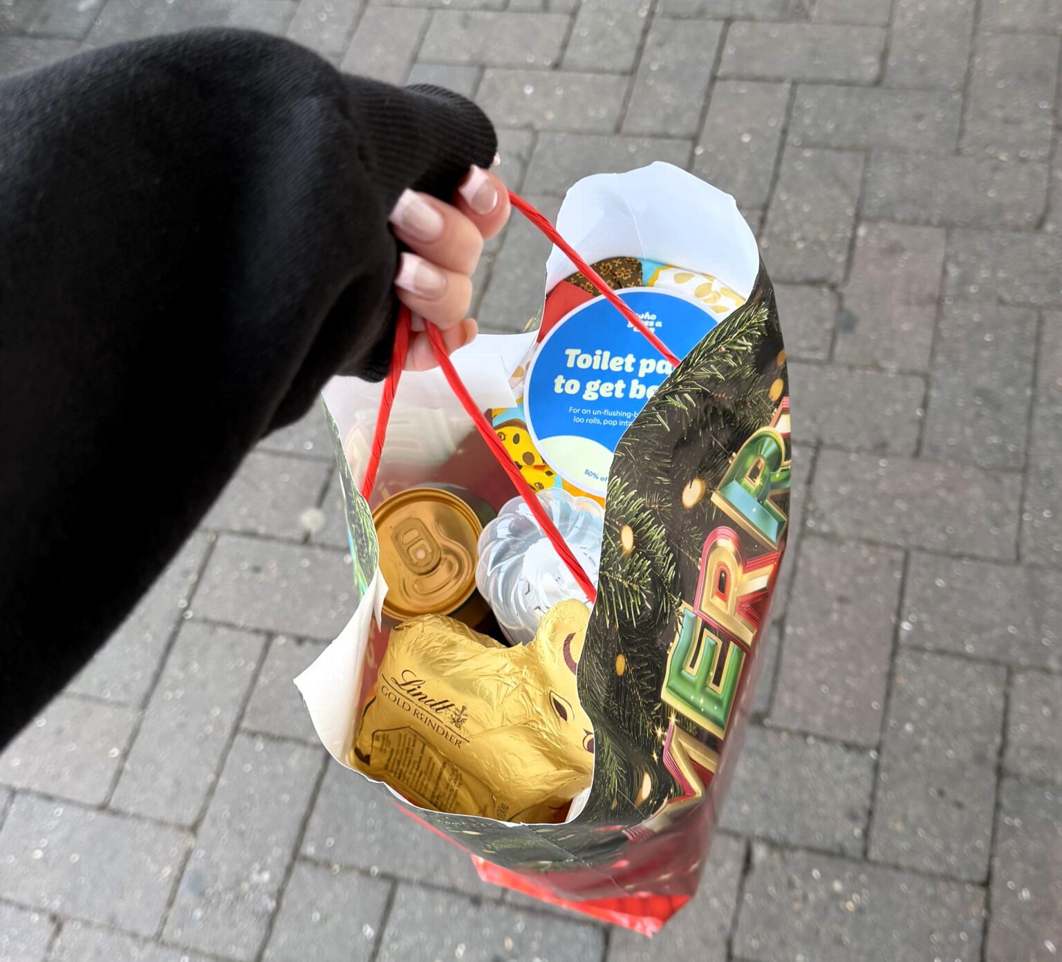 Shopper visits Tesco Christmas market and bags free festive goodies worth up to 20 pounds after spending just 3.50 praising the cute event and generous samples touring UK stores this December.