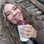 An American tourist goes viral after embarrassing culture slip ups in Scotland from asking about air con to hat etiquette yet falls in love with Edinburgh Glasgow and the people.