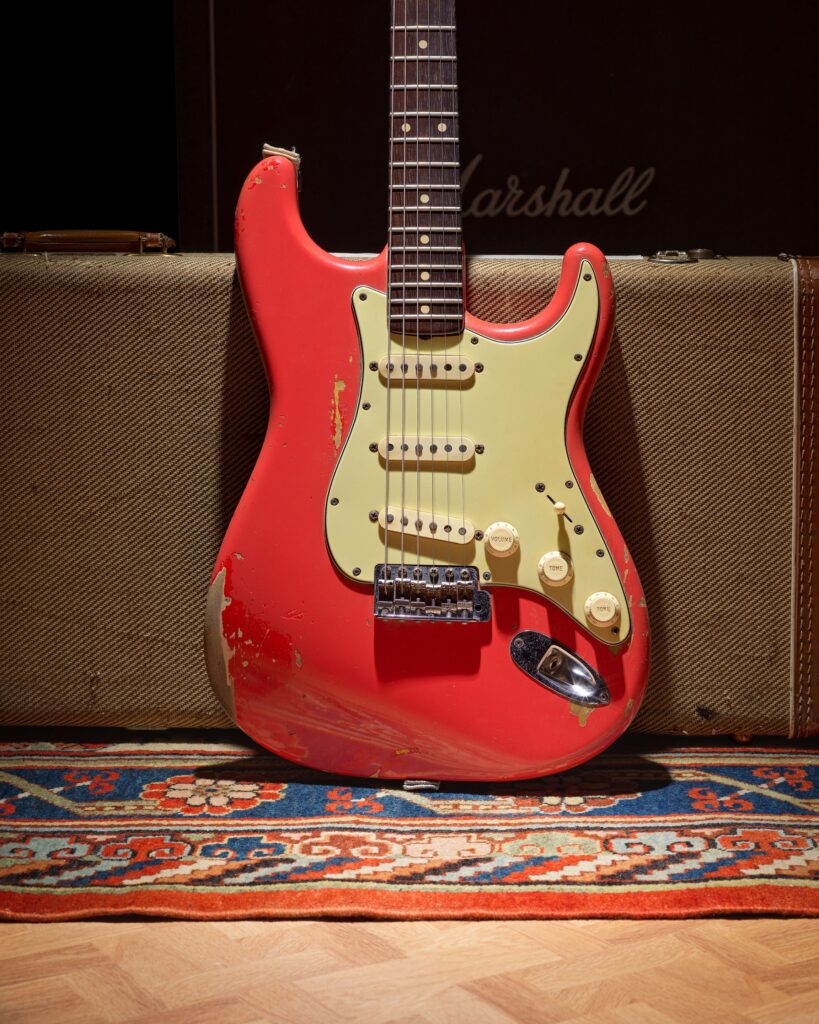 Gary Moore’s heavily played 1961 pink Fender Stratocaster sold for £254400 at Bonhams after decades of studio use tours and iconic performances cementing its status as a rock history treasure.