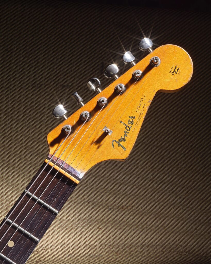 Gary Moore’s heavily played 1961 pink Fender Stratocaster sold for £254400 at Bonhams after decades of studio use tours and iconic performances cementing its status as a rock history treasure.