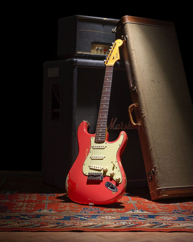 Gary Moore’s heavily played 1961 pink Fender Stratocaster sold for £254400 at Bonhams after decades of studio use tours and iconic performances cementing its status as a rock history treasure.