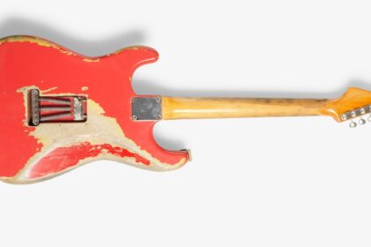 Gary Moore’s heavily played 1961 pink Fender Stratocaster sold for £254400 at Bonhams after decades of studio use tours and iconic performances cementing its status as a rock history treasure.
