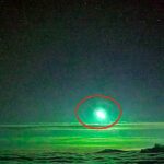 Rare bright green meteor lights up clouds over Taiwans Central Mountain Range, as stunning bolide footage captures the fireball blazing through the night sky.
