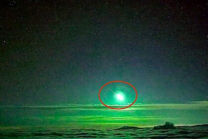 Rare bright green meteor lights up clouds over Taiwans Central Mountain Range, as stunning bolide footage captures the fireball blazing through the night sky.