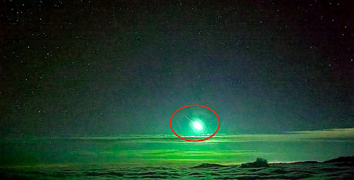 Rare bright green meteor lights up clouds over Taiwans Central Mountain Range, as stunning bolide footage captures the fireball blazing through the night sky.