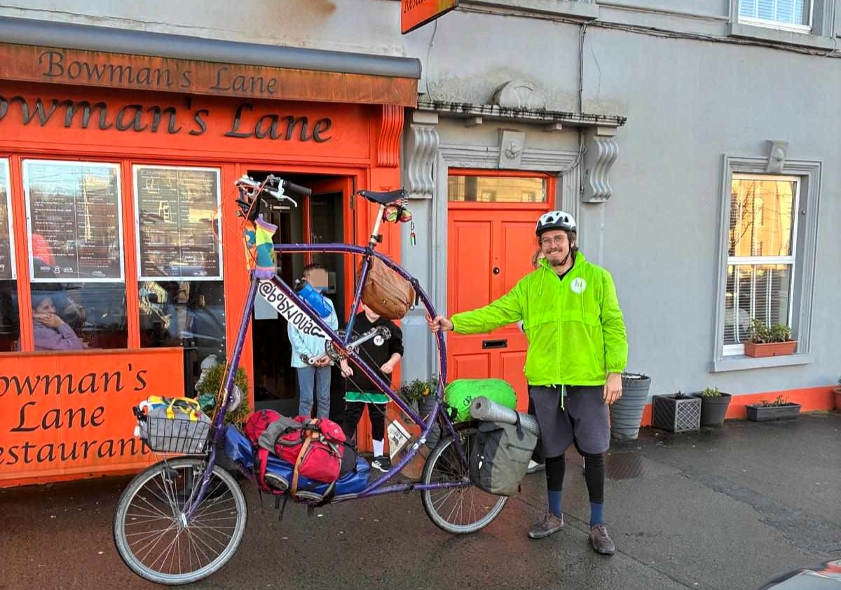 Cyclist turns heads riding six foot tall handmade bike across Ireland as French adventurer pedals unique creation built from recycled parts on language learning tour.