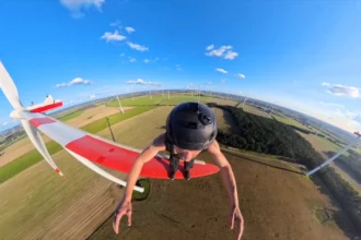 Daredevil George King leaps from spinning wind turbine blades hundreds of feet in the air as the notorious Shard climber pulls off one of his most extreme stunts yet.