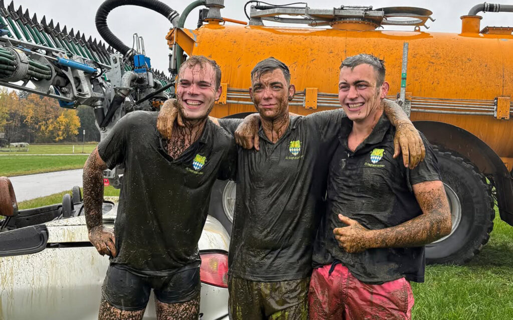 Three farmers drench themselves in manure in a convertible to promote festival beer tent viral stunt in Germany hits millions showing rural humour bold creativity and scrappy marketing.