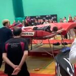 A Liverpool gymnast briefly knocked out mid routine rebounds minutes later to land a 14.0 difficulty record nine double somersaults and a triple stunning viewers with his determination.