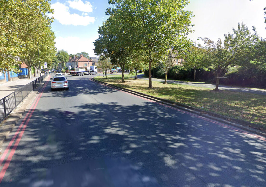 Baffled locals watch as a silver hatchback ends up balanced on a bent bollard in north London leaving wheels off the ground and jokes flying near Spurs stadium at rush hour.