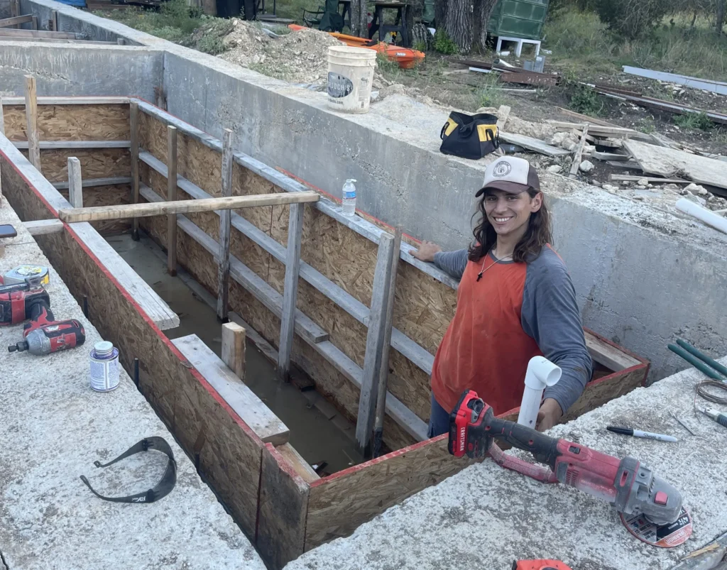 Influencer reveals stunning shipping container home with spiral staircase rooftop deck and sunrise views as couple turn $180k build into cosy sustainable dream Airbnb.