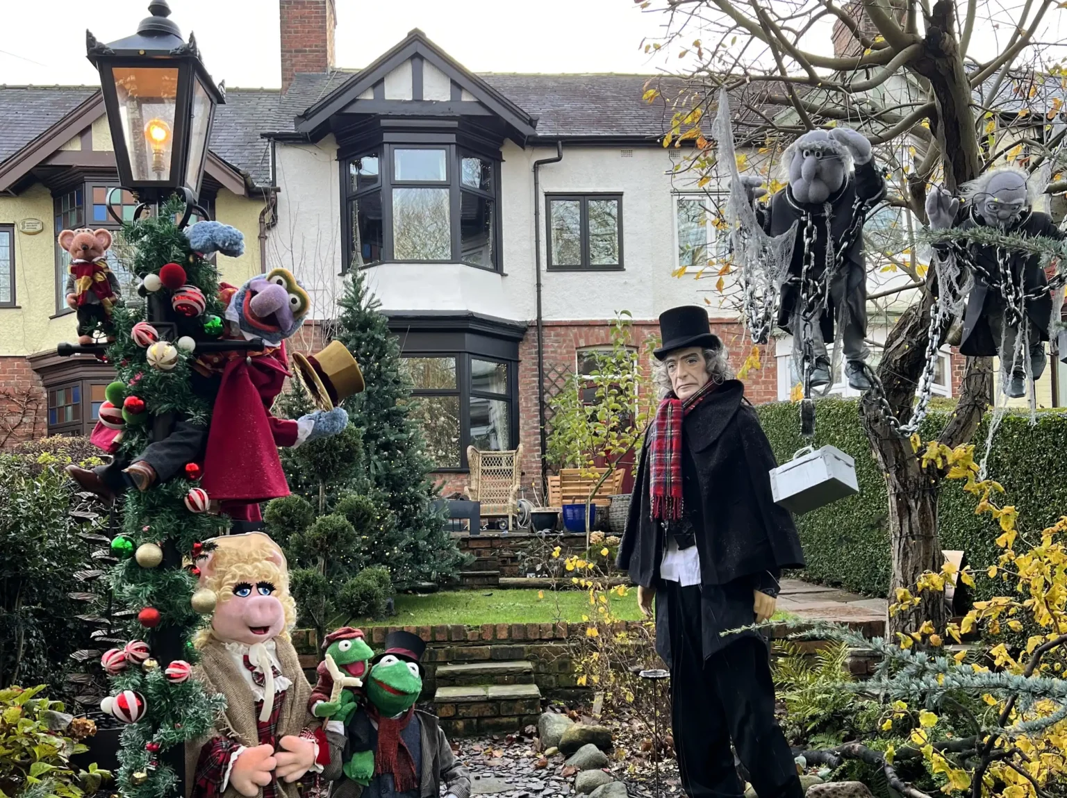 A woman creates a magical Muppets Christmas Carol garden display for just 100 pounds featuring handmade 3D characters that delight neighbours and captivate children throughout the festive season.