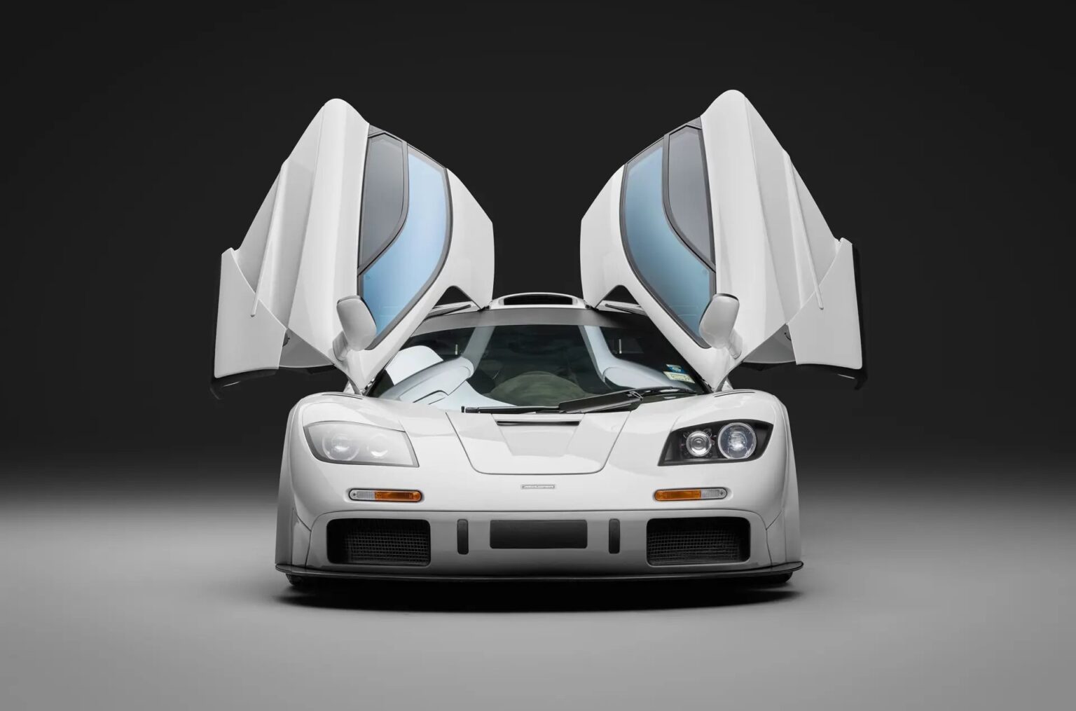McLaren F1 once owned by Brunei royalty sells for £19m-record price-high downforce upgrades-signatures from Schumacher and Hamilton-makes history as 13th most expensive car ever.