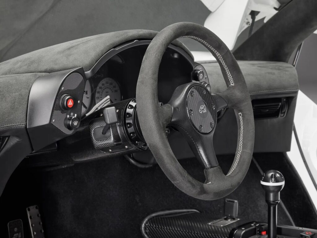 McLaren F1 once owned by Brunei royalty sells for £19m-record price-high downforce upgrades-signatures from Schumacher and Hamilton-makes history as 13th most expensive car ever.