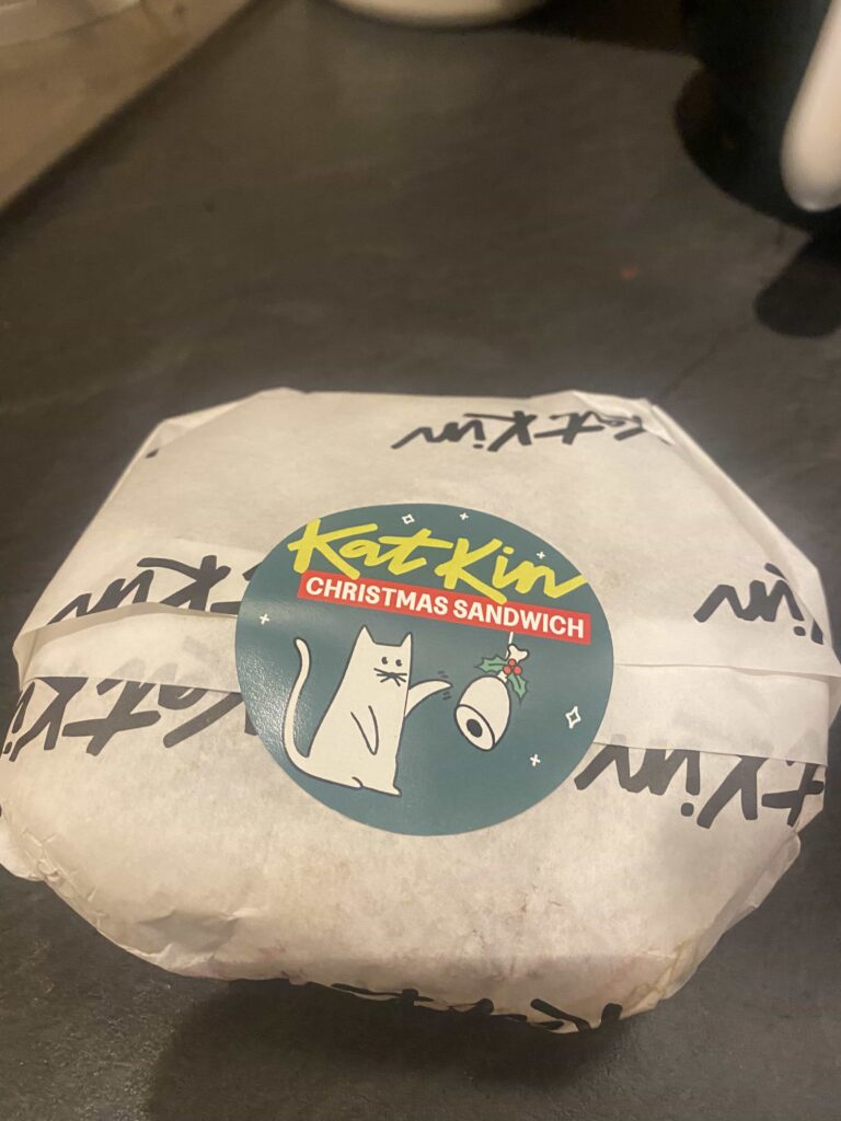 A Michelin trained chef unveils a strange festive cat food Christmas sandwich using “human quality” turkey from KatKin but its overpowering smell makes it nearly impossible to eat.