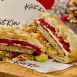 A Michelin trained chef unveils a strange festive cat food Christmas sandwich using “human quality” turkey from KatKin but its overpowering smell makes it nearly impossible to eat.