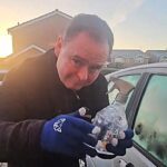 Driver shares free de icing hack using warm water in an old spray bottle to clear frozen windscreens in seconds saving money and time on cold winter mornings across the UK.