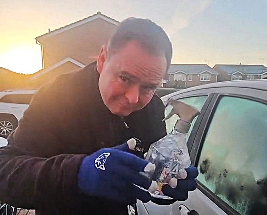 Driver shares free de icing hack using warm water in an old spray bottle to clear frozen windscreens in seconds saving money and time on cold winter mornings across the UK.