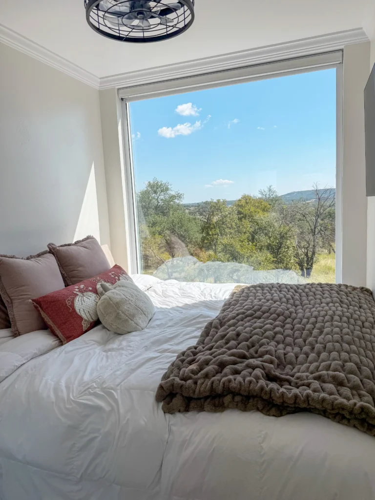 A couple built a 624 sq ft shipping container home on 12.5 Texas acres for far less than traditional housing, with monthly bills of just £440 including water generated from air.