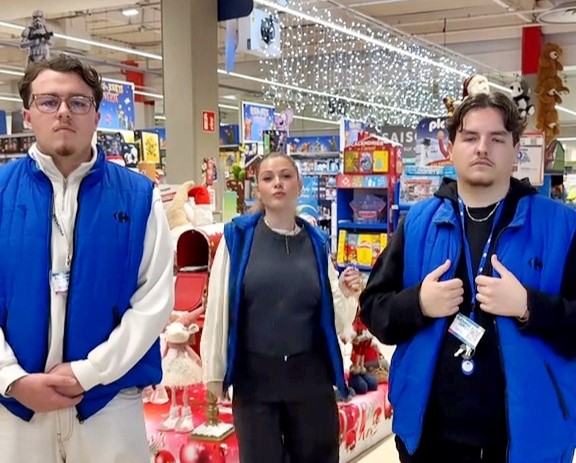 Supermarket hires security guard to protect teenage cashier after her checkout dance videos went viral on TikTok, drawing crowds and millions of views at French store site.