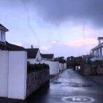 Jersey residents were stunned by a swirling cloud funnel that looked like a tornado as a rare weather vortex hovered for an hour before fading without touching the ground.