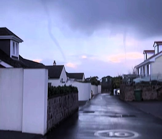 Jersey residents were stunned by a swirling cloud funnel that looked like a tornado as a rare weather vortex hovered for an hour before fading without touching the ground.