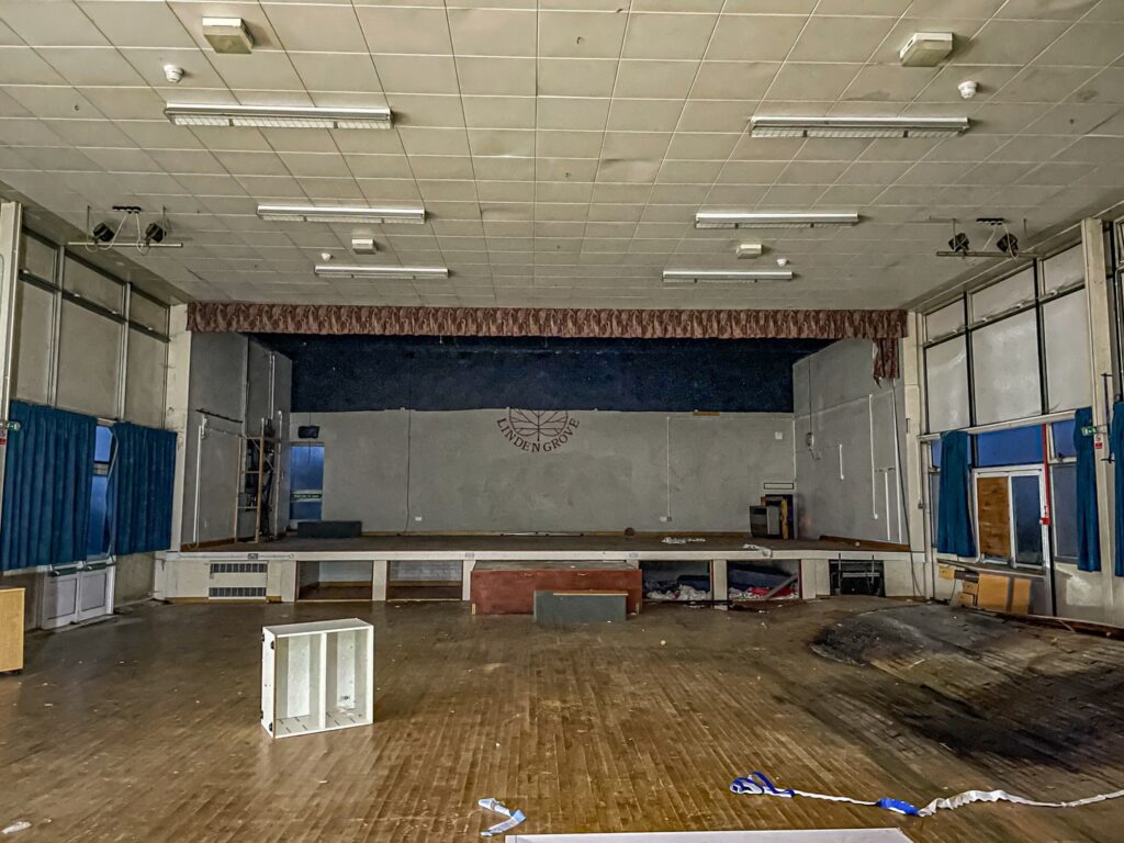 Urban explorer uncovers eerie abandoned primary school frozen in time since 2012, with ivy filled classrooms mouldy halls and grass growing indoors near Kent in darkness.