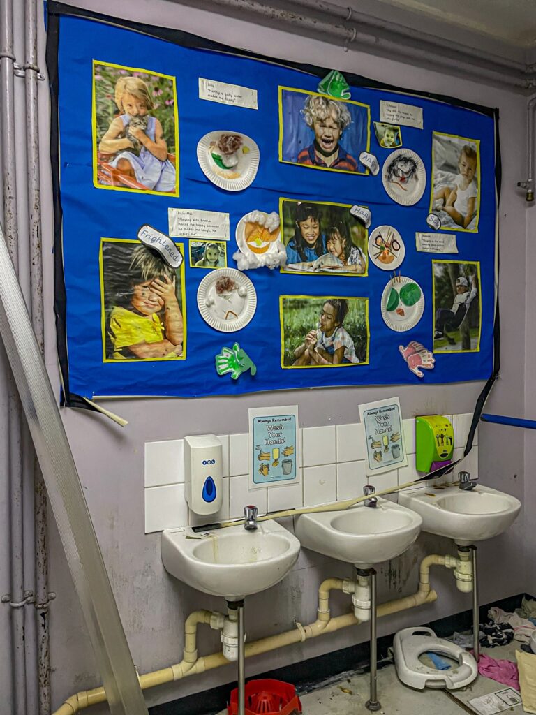 Urban explorer uncovers eerie abandoned primary school frozen in time since 2012, with ivy filled classrooms mouldy halls and grass growing indoors near Kent in darkness.