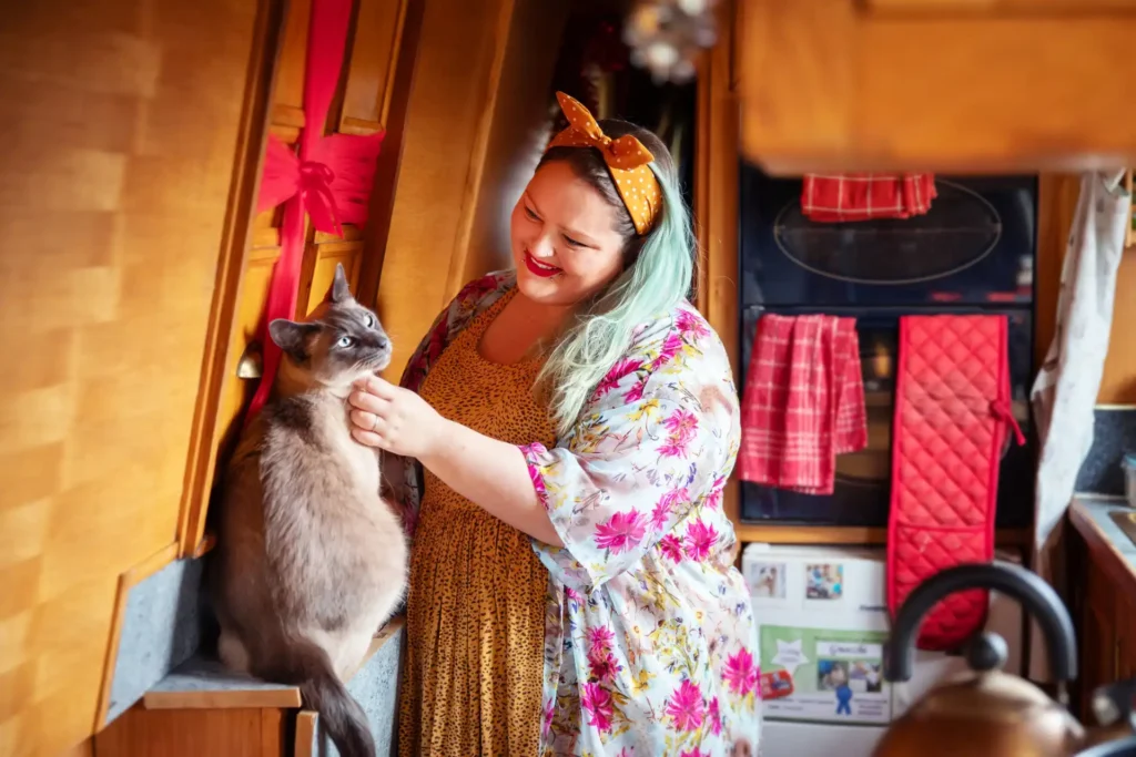 Couple living on a 57ft narrowboat reveal the joys and challenges of moving every two weeks saving money while embracing a cosy peaceful lifestyle that feels like a nonstop holiday even at Christmas.
