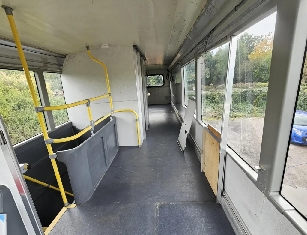 Woman fulfils childhood dream by turning a double decker bus into a home but says living on wheels costs as much as a house with rising insurance fuel and upkeep bills.