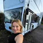 Woman fulfils childhood dream by turning a double decker bus into a home but says living on wheels costs as much as a house with rising insurance fuel and upkeep bills.