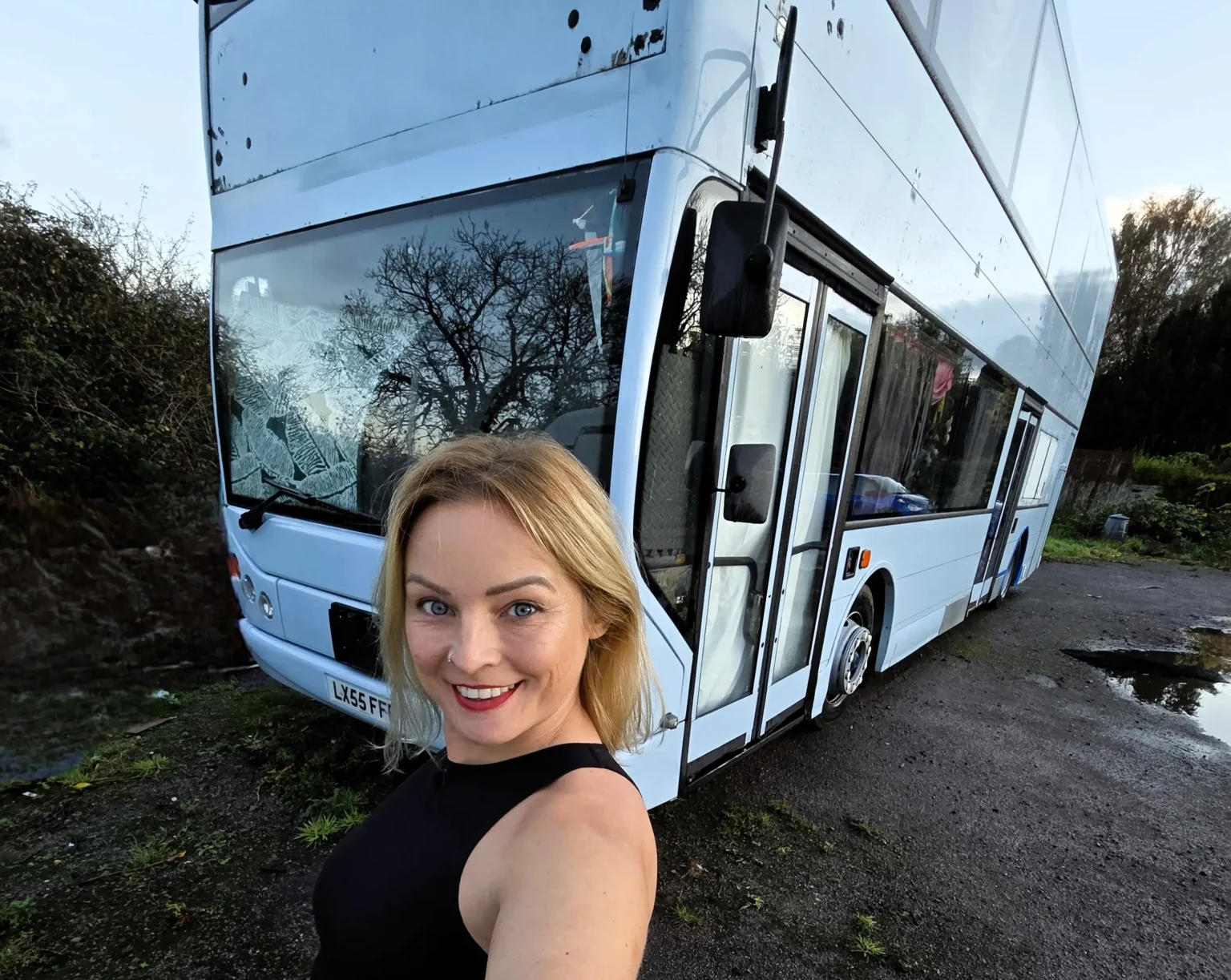 Woman fulfils childhood dream by turning a double decker bus into a home but says living on wheels costs as much as a house with rising insurance fuel and upkeep bills.