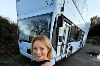 Woman fulfils childhood dream by turning a double decker bus into a home but says living on wheels costs as much as a house with rising insurance fuel and upkeep bills.