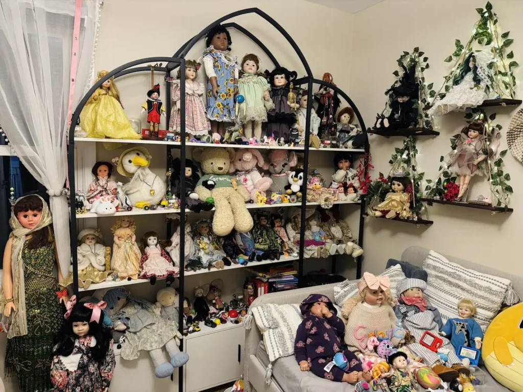 Woman living with 54 haunted dolls reveals spooky Christmas antics as mischievous spirits pull down stockings play music and cause festive paranormal chaos at home.