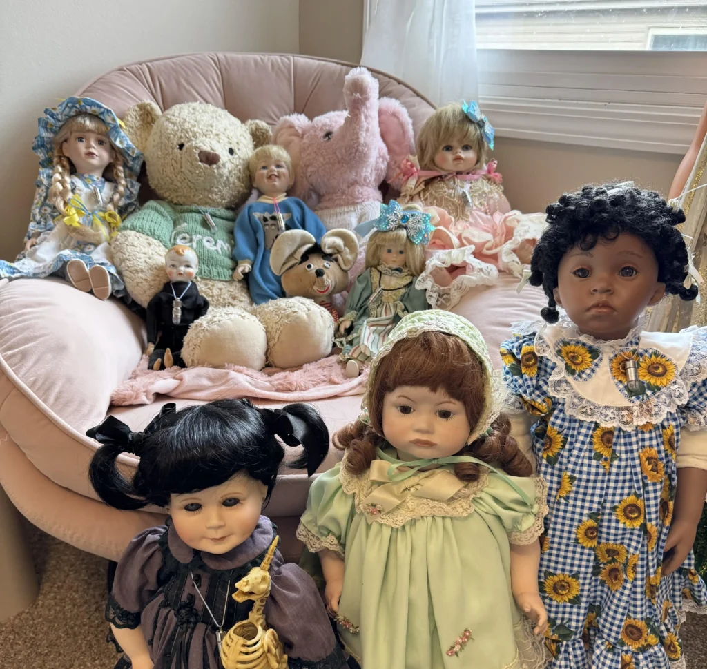 Woman living with 54 haunted dolls reveals spooky Christmas antics as mischievous spirits pull down stockings play music and cause festive paranormal chaos at home.