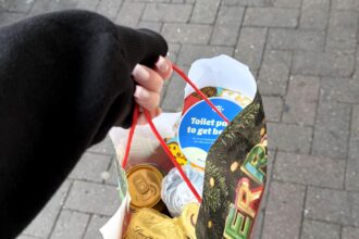 Shopper visits Tesco Christmas market and bags free festive goodies worth up to 20 pounds after spending just 3.50 praising the cute event and generous samples touring UK stores this December.